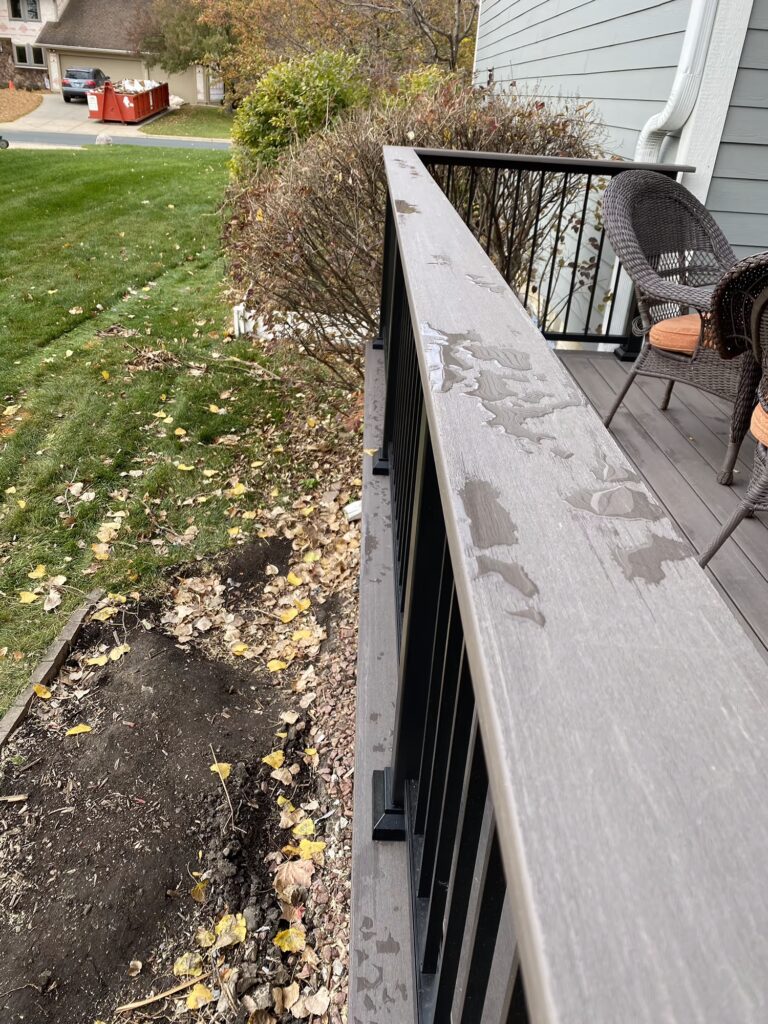 TimberTech Advanced PVC Dark Hickory drink rail on a deck. 