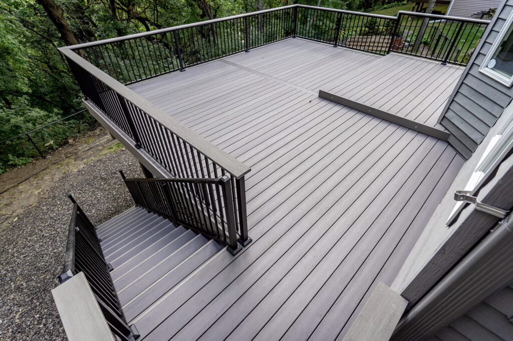 Aerial view of the gray PVC deck with steps down to ground level. 