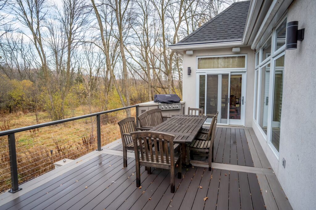 Upper level of custom deck using TimberTech Advanced PVC with contrasting picture frame and splitter board color.