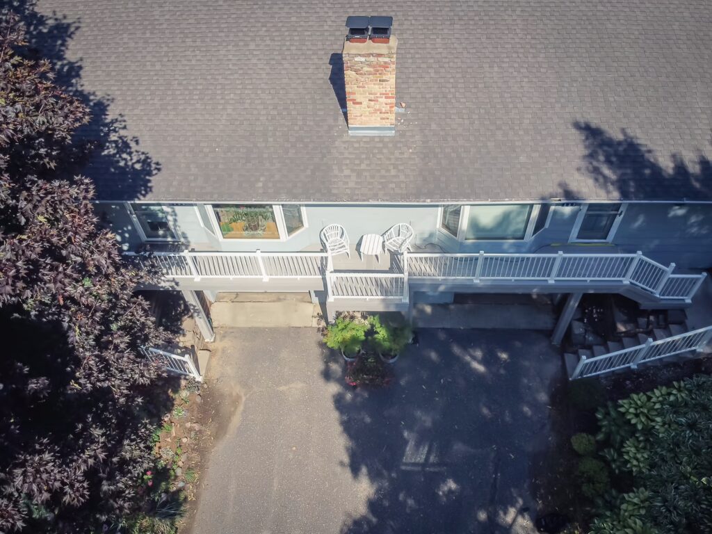 Aerial view of long deck spanning the length of a duplex.