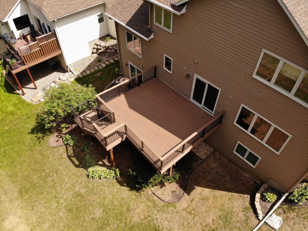 Large deck on the back of a house, view from the sky.