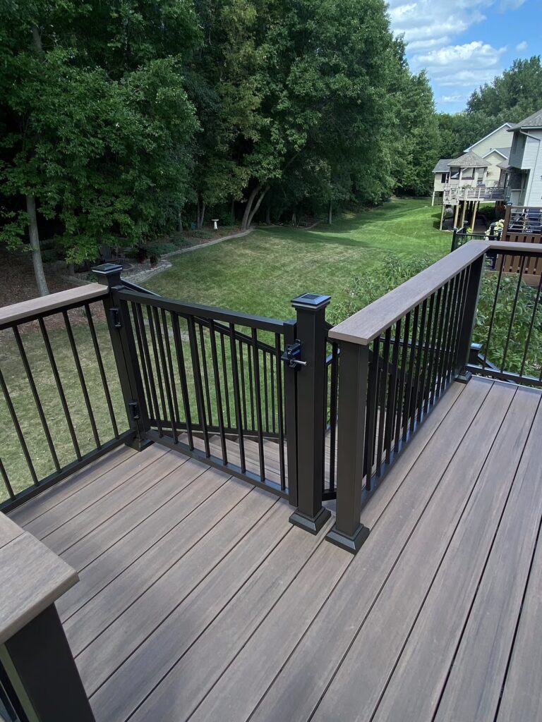 Stair gate at the top of deck stairs.