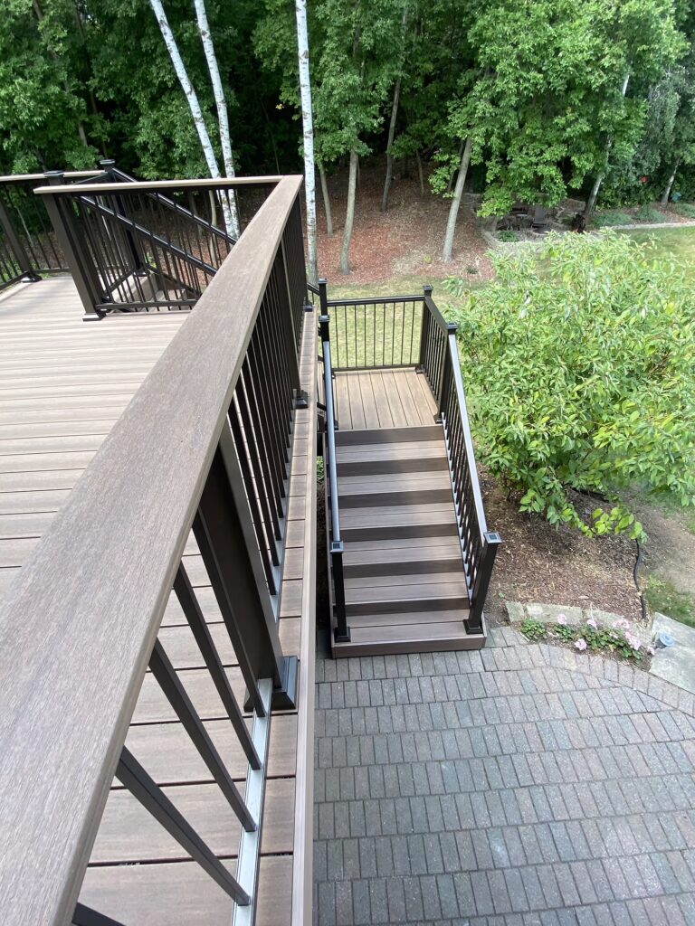 PVC deck looking down at L-shaped stairs.