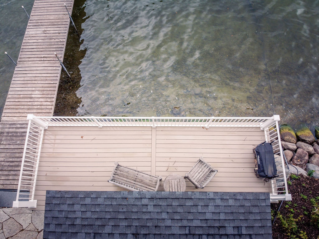 Aerial view of boathouse deck using TimberTech Advanced PVC and Westbury railing. 