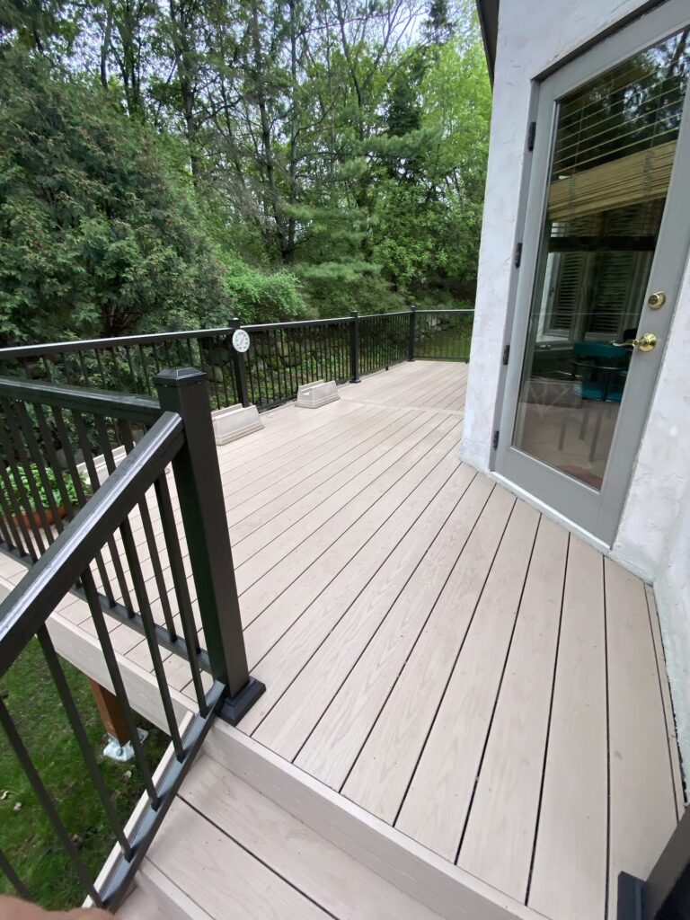 TimberTech deck wrapping around the side of a house. 