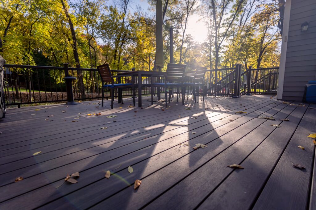Large expanse of TimberTech Advanced PVC in American Walnut from the Landmark Collection during a fall afternoon. 