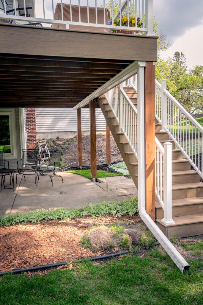 Composite deck with stairs and EPDM drainage system. 
