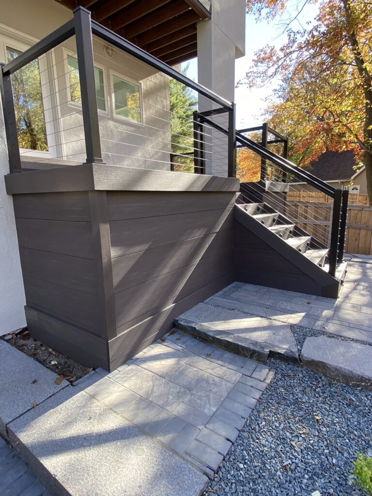 Deck with dark-colored PVC skirting.