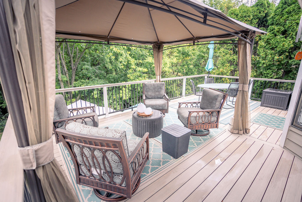 Furnished deck built with TimberTech Advanced PVC in French White Oak.