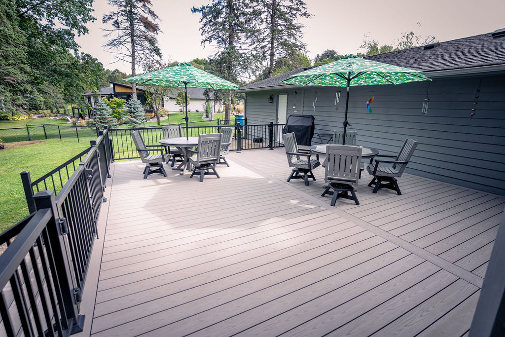 Alternate view of large gray composite deck with black aluminum railing.
