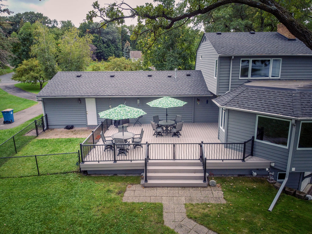 Front aerial view of TimberTech Advanced PVC platform deck with custom wide staircase and double safety gate.