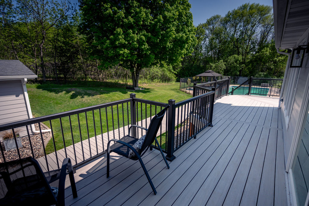 Composite deck with bump-out area for seating.