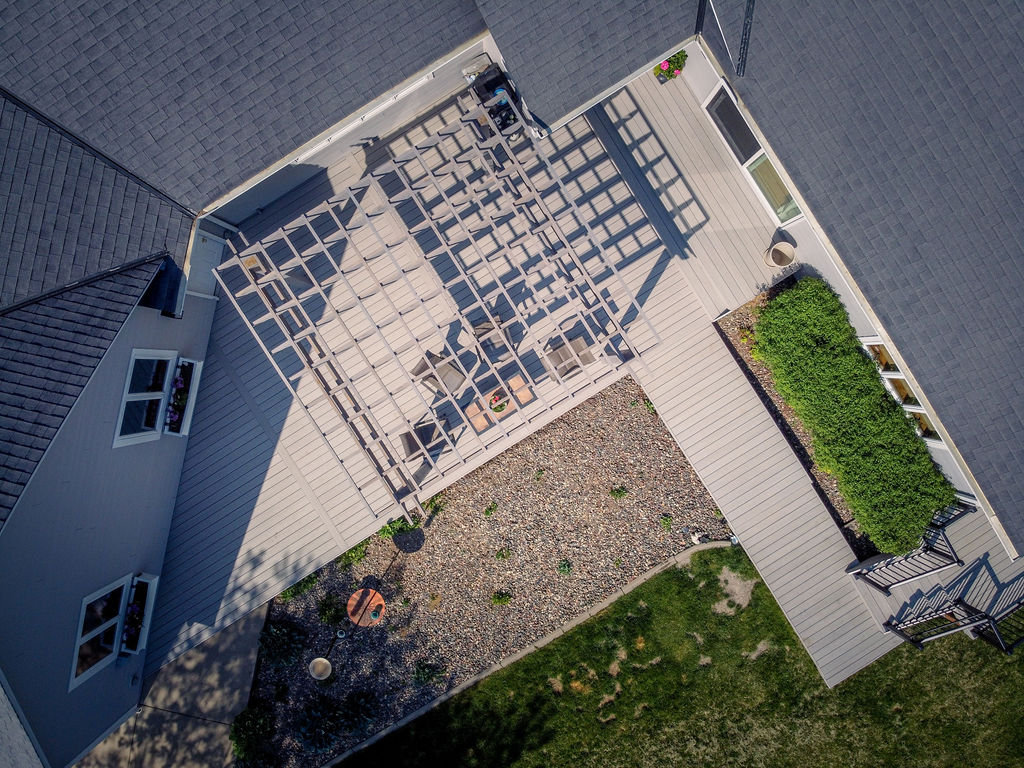 Aerial top view of cedar pergola on platform deck with composite decking.